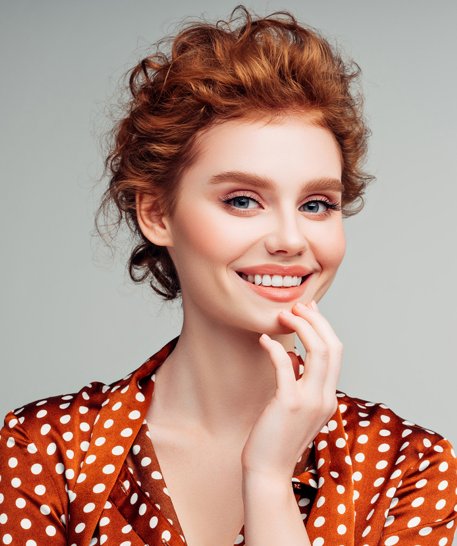 Beautiful woman with red hair smiling